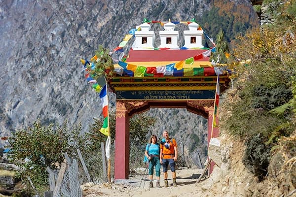 Hikers taking snap just Infront of Traditional welcome gate during manaslu circuit Trek Nepal.